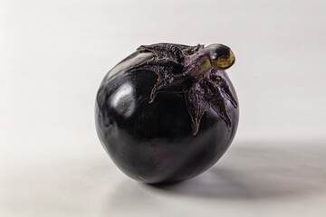 Raw round black big eggplant