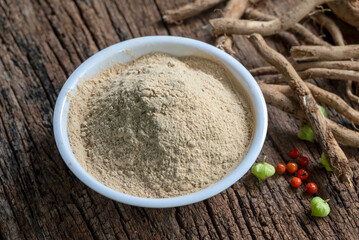 Withania Somnifera, Ashwagandha, Indian Ginseng, Poison Gooseberry or Winter Cherry on the wooden Background. Medicinal Herb