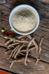 Withania Somnifera, Ashwagandha, Indian Ginseng, Poison Gooseberry or Winter Cherry on the wooden Background. Medicinal Herb