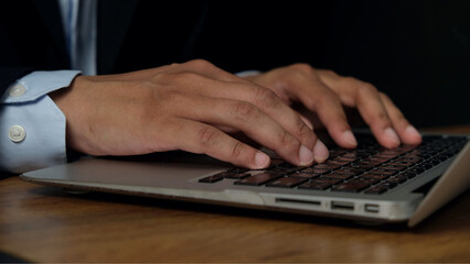 Business, office, working, typing, hands, laptop, professional, technology, communication, productivity. close up of person in formal attire typing on laptop, symbolizing focus and business growth