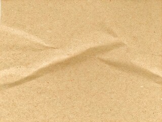 Recycled brown paper crumpled texture background. Abstract wrinkled and folded craft paper surface. Crumpled brown recycle paper background with copy space for text.