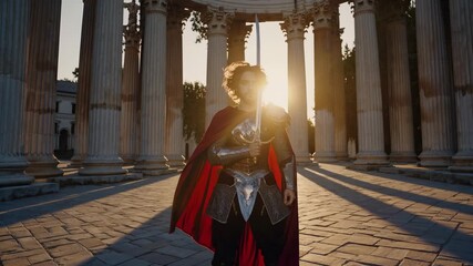 Knight holds sword near monument. Warrior in armor and red cape stands in sunlight by column. Medieval hero looks forward with confident pose. Cinematic atmosphere evokes epic historical drama. Epic. - Powered by Adobe