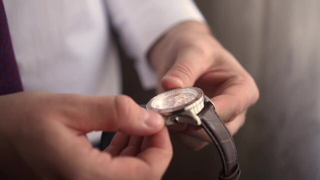 a man looks at a clock