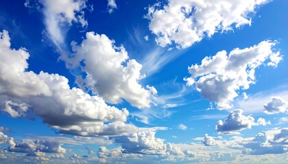 A vibrant photograph of a bright blue sky filled with puffy, white cumulus clouds. Wisps and streaks add texture