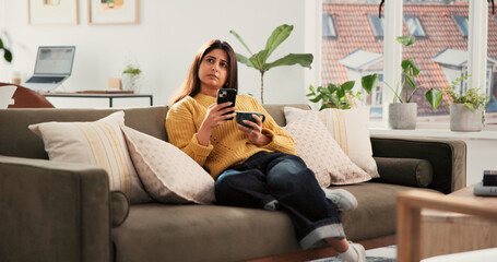 Woman, phone and thinking with coffee on sofa, texting and web chat with online dating in home....