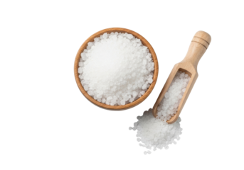 Natural wooden bowl and scoop with large grain white sea salt, spilled on transparent background, top-down. Concept of natural purity and high quality