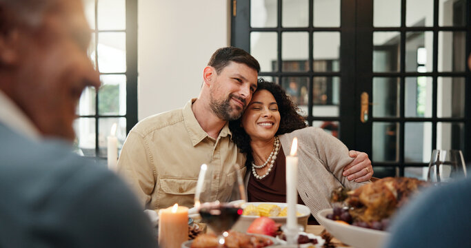 Celebration, Christmas and hug with couple in dining room of home together for family gathering. Food, holiday tradition and love with happy people at table for banquet, dinner or festive feast - Powered by Adobe