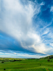 Sunset views over rural farmland with beautiful cloud formations