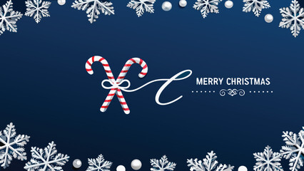 Festive merry christmas greeting card with crossed candy canes and snowflakes on a deep blue background