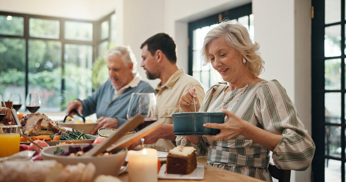 Serving, family and thanksgiving lunch in home for holiday season, eating together and celebration. Festive feast, food or people with social gathering at dining table for tradition, bonding or party