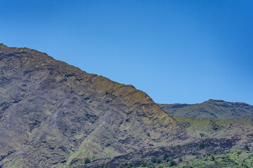 Obraz premium Kaupō Gap. Hawaii Route 31 ( Pi'ilani Highway ), Maui, Hawaii. Haleakalā, or the East Maui Volcano, is a massive, active shield volcano.