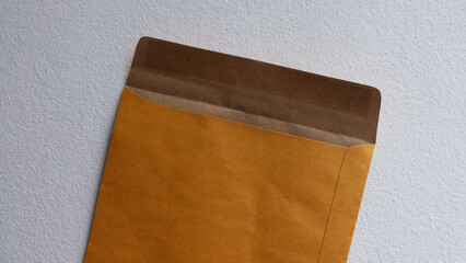 Brown opened envelope, flat lay design