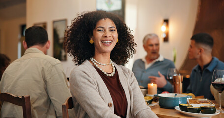 Thanksgiving, portrait and smile with woman in dining room for holiday season, dinner or tradition. Festive feast, party or event with people eating in home for food, hosting and hospitality together