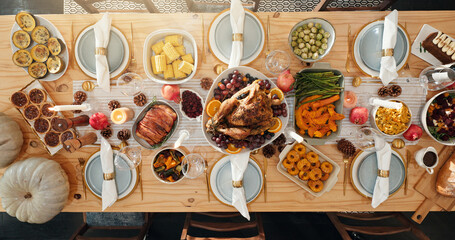 Above, table and food for thanksgiving at house with roast turkey, healthy vegetables and...