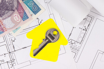 Polish currency banknotes, diagrams of electric installation, key and shape of house. Planning build or buy of home