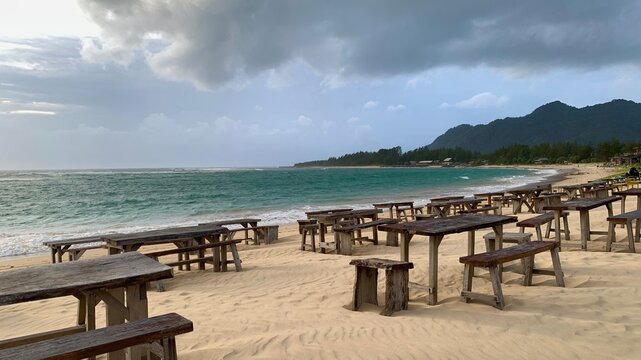 Indonesia 25 november 2025, photo of a beautiful sandy beach view with aesthetic seating arrangements.