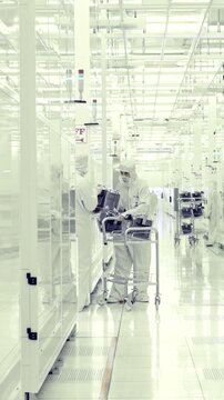 Vertical footage of workers in a Semiconductor manufacturing facility