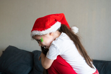 Sisters in Christmas pajamas hug each other