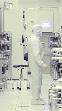 Vertical footage of workers in a Semiconductor manufacturing facility
