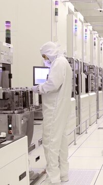 Vertical footage of workers in a Semiconductor manufacturing facility