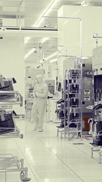 Vertical footage of workers in a Semiconductor manufacturing facility