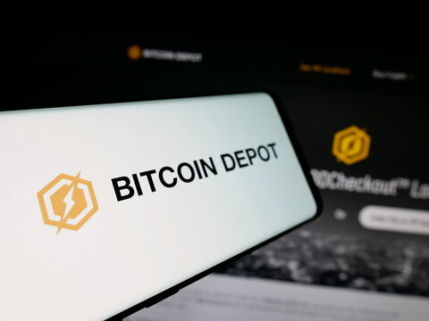 Stuttgart, Germany - 11-02-2025: Smartphone with logo of US BTC ATM (BTM) company Bitcoin Depot Inc. on screen in front of website. Focus on center-left of phone display.