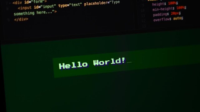 ComputerDigital terminal displaying "Hello World!" message against a dark coding background. Computer screen