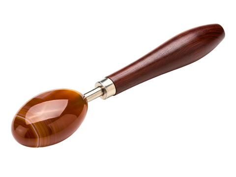 Polished agate stone burnisher with a dark wood handle for crafts on a transparent background - Powered by Adobe