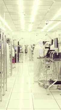 Vertical footage of workers in a Semiconductor manufacturing facility