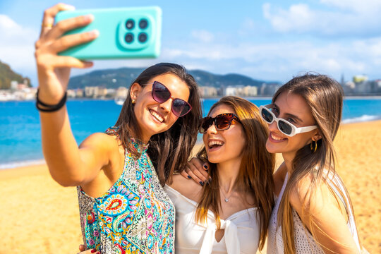 Happy friends taking selfie on summer beach vacation - Powered by Adobe