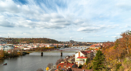 Colourful, autumn panorama of Prague from the river side, in daylight, with the Royal Hill (Hradcany)
