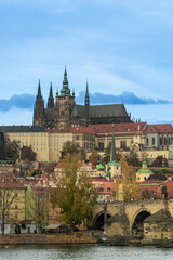 Colourful, autumn panorama of Prague from the river side, in daylight, with the Royal Hill (Hradcany)