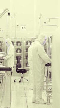 Vertical footage of workers in a Semiconductor manufacturing facility