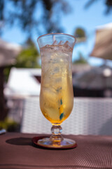 Fresh apple juice cocktail on an outdoor terrace scene