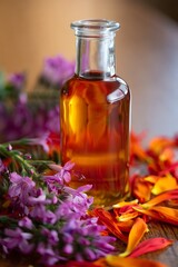 Infused oil with colorful flowers and petals for aromatherapy purposes