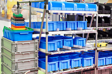 Rack with plastic trays for storing small parts