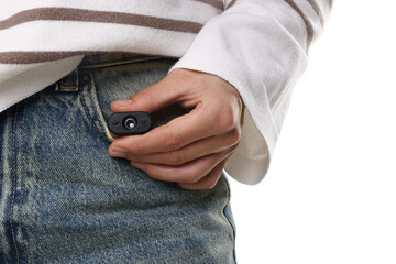 Young woman with hidden spy camera on white background, closeup