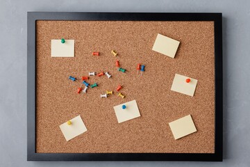A Tidy Corkboard Displaying Colorful Pushpins and Blank Notes, Ready for Messages, Reminders, and...