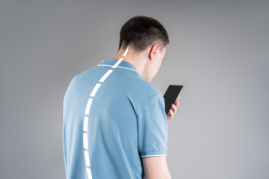 Man with neck pain from using smartphone, text neck and bad posture concept
