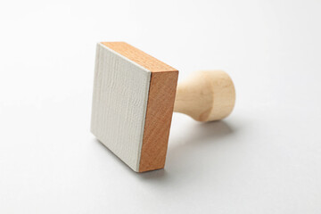One wooden stamp on white background, closeup