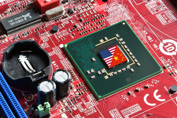 Flag of the Republic of China and the United States on microchip of a PC Motherboard. Concept for world supremacy in microchip and semiconductor manufacturing.