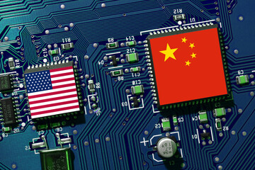 Flag of the Republic of China and the United States on microchip of a PC Motherboard. Concept for world supremacy in microchip and semiconductor manufacturing.