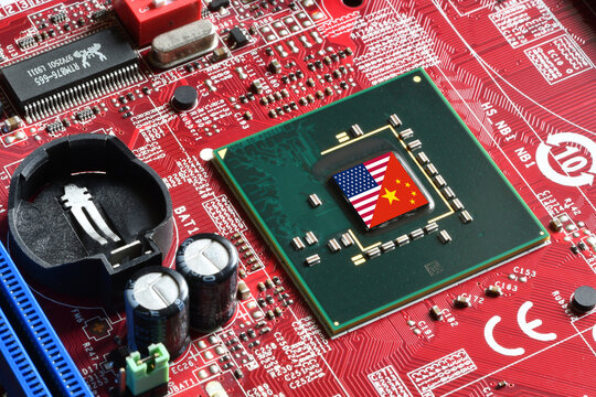 Flag of the Republic of China and the United States on microchip of a PC Motherboard. Concept for world supremacy in microchip and semiconductor manufacturing.