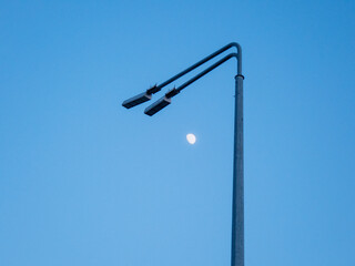 Moon in the sky under a lantern