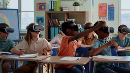 Students in a classroom, wearing VR headsets, explore immersive educational experiences Stock Video - Powered by Adobe
