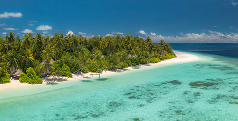 Stunning aerial view pristine tropical Maldives island dense green jungle lush palm trees white...