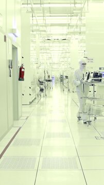 Vertical footage of workers in a Semiconductor manufacturing facility