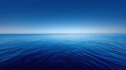 Obraz premium Tranquil and Serene Ocean View with Clear Blue Waters and Endless Horizon Under the Bright Daylight Sky for Peaceful Nature Themes