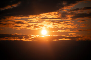 A beautiful sunset sky with clouds over the Baltic Sea.