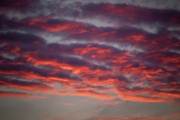 Fotobehang Crimson A beautiful sunset sky with clouds over the Baltic Sea.  © dachux21